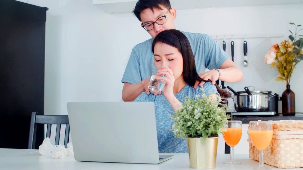 couple drinking purified water on the dining table