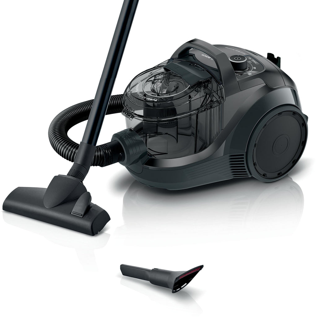 Black vacuum cleaner with attachments on a white background