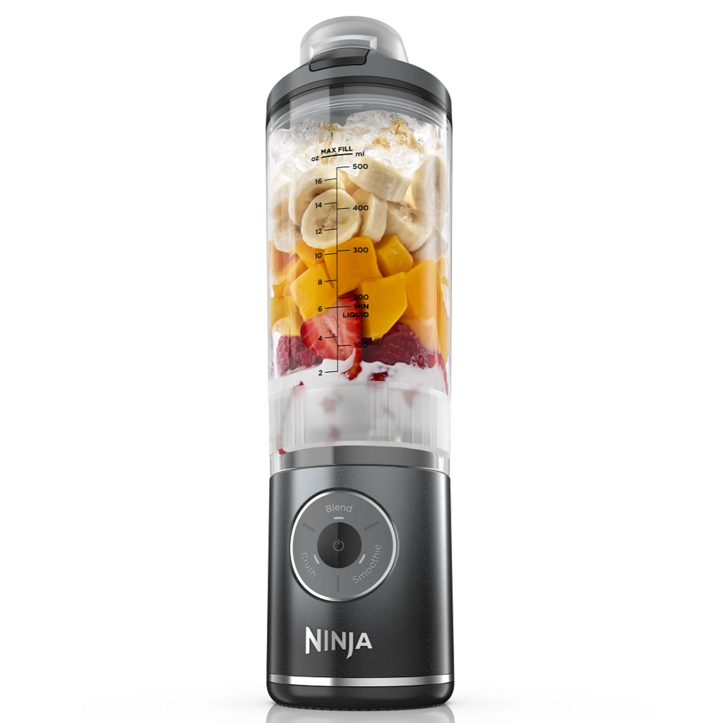 Ninja grey blender with ingredients inside on a white background